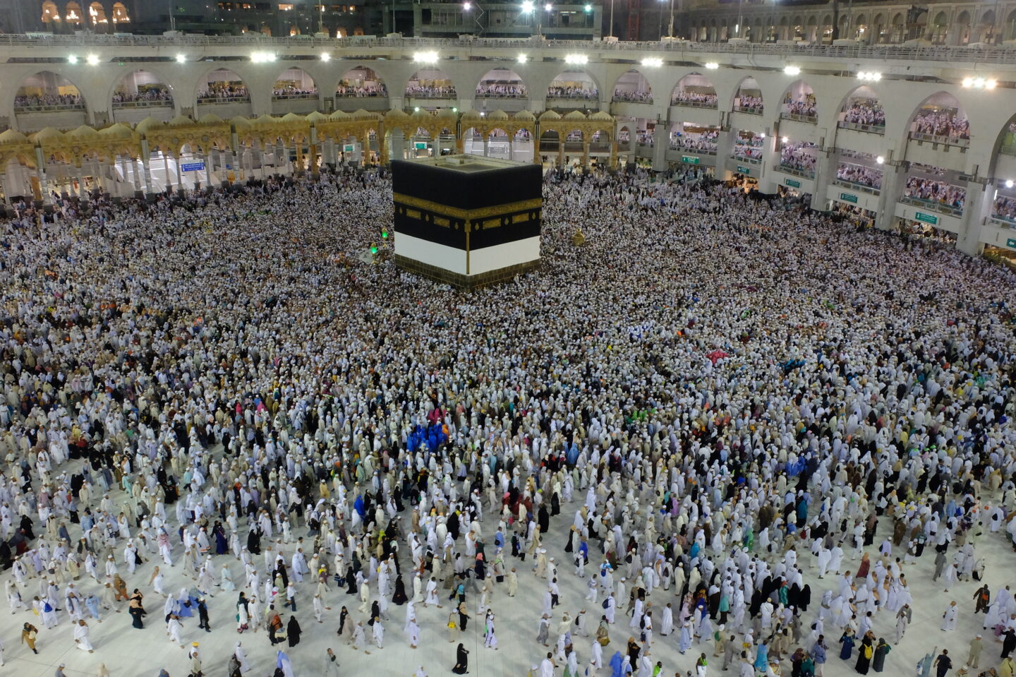 Wide view of pilgrims at the Holy Kaaba in Masjid Al-Haram, where meningitis ACWY vaccination is required for Hajj and Umrah