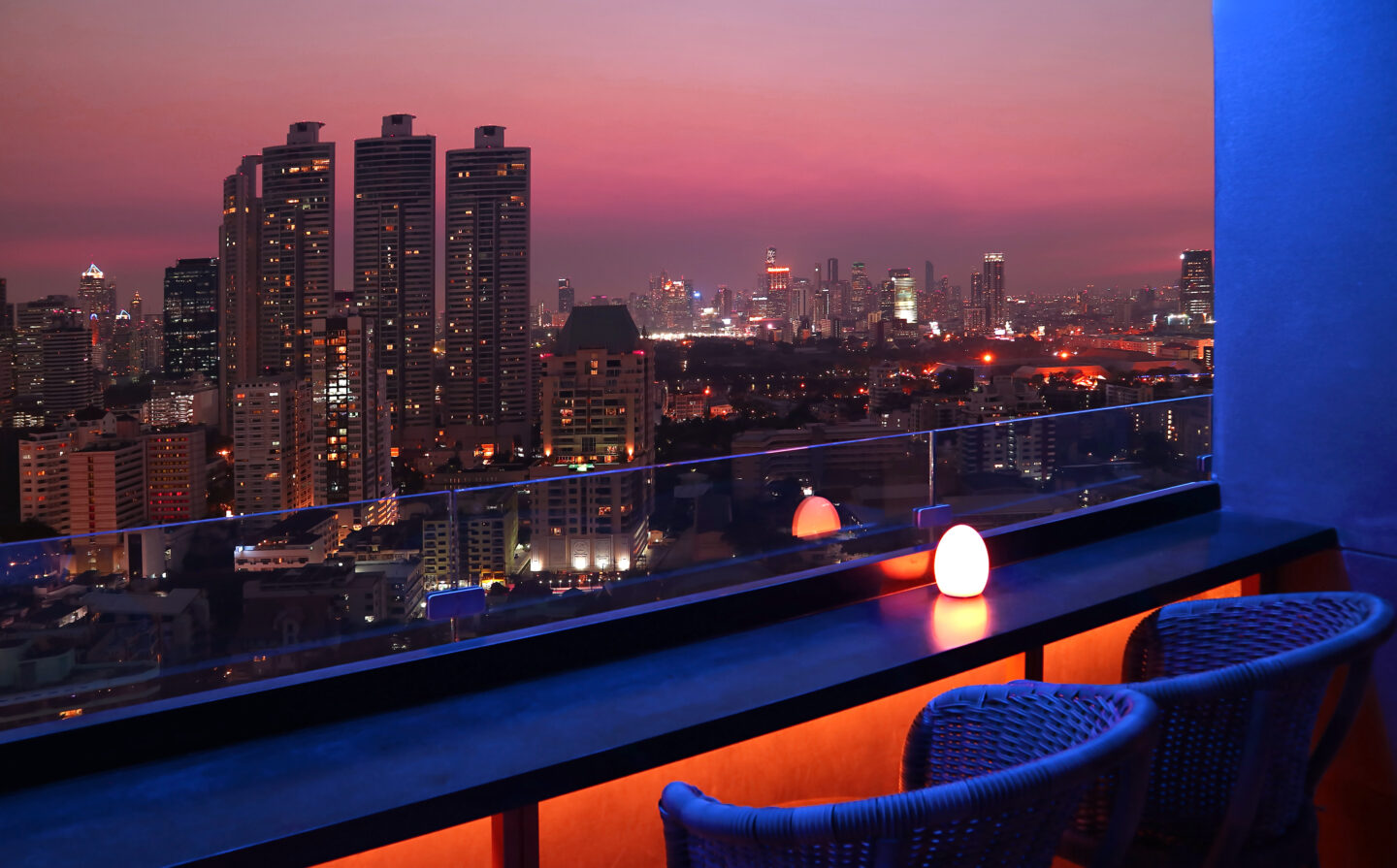 Tropical city skyline at dusk in Bangkok, a region where dengue fever precautions are recommended for travellers