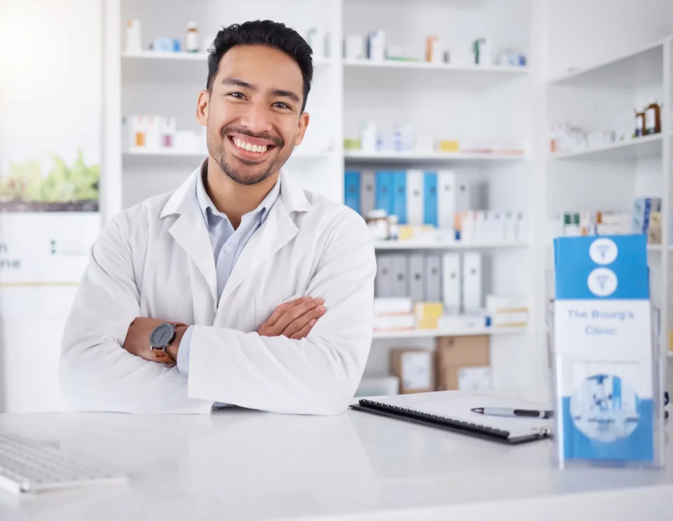 A pharmacist behind the counter at the clinic
