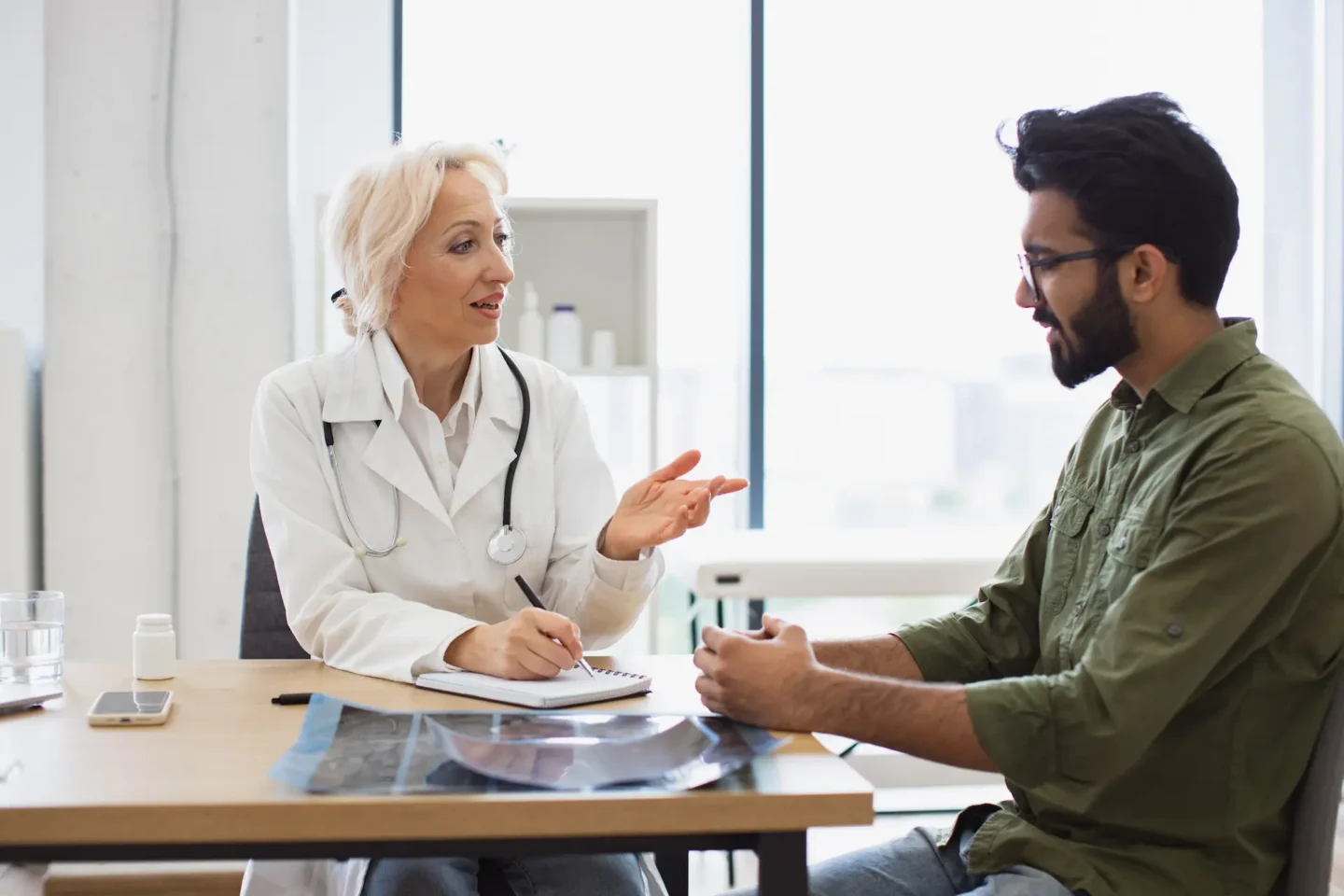 A pharmacist discussing a health concern with a customer