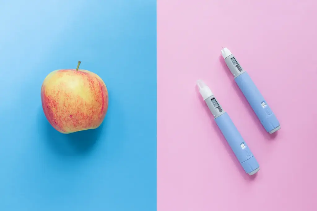The Best Way To Lose Weight And Keep It Off For Good 3 delicious apple on a blue background and two injec 2024 12 26 20 57 20 utc 1