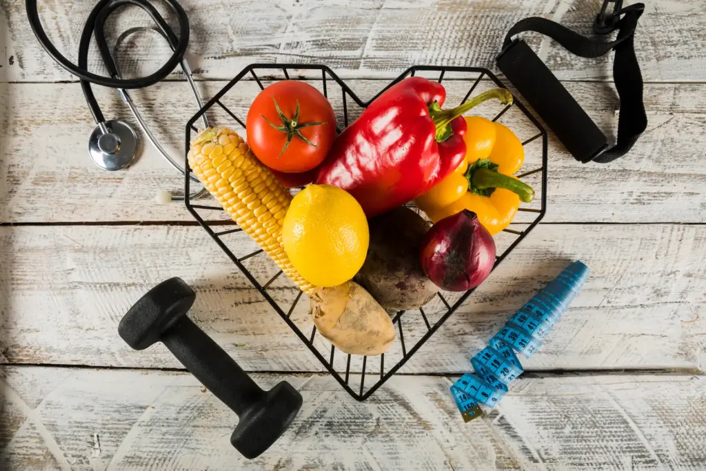 The Best Way To Lose Weight And Keep It Off For Good 1 fresh vegetables surrounded by fitness equipments stethoscope measuring tape