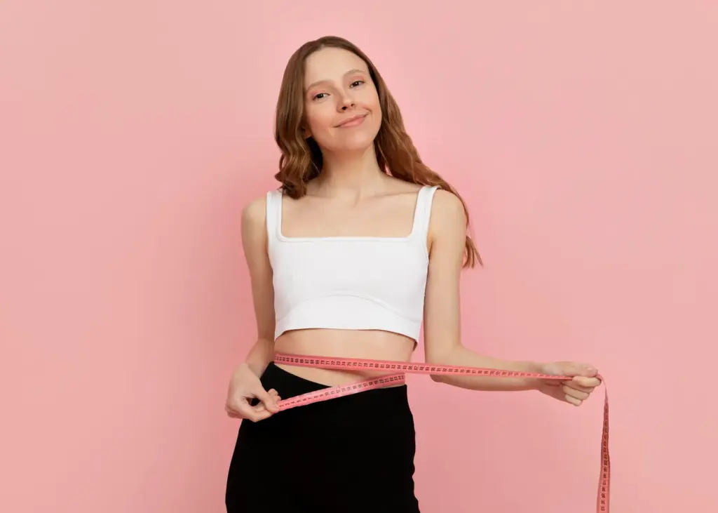 What results to expect with Mounjaro, a Week by Week Guide 2 medium shot woman measuring herself 1 1