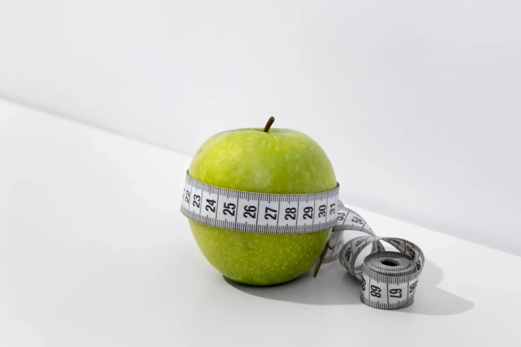 Mounjaro for Weight Loss: Benefits, Risks and Everything You Need to Know 1 view tape measure with apple fruit 1 1